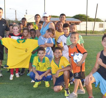 brings joy and encouragement to the little soccer players of Aruba
